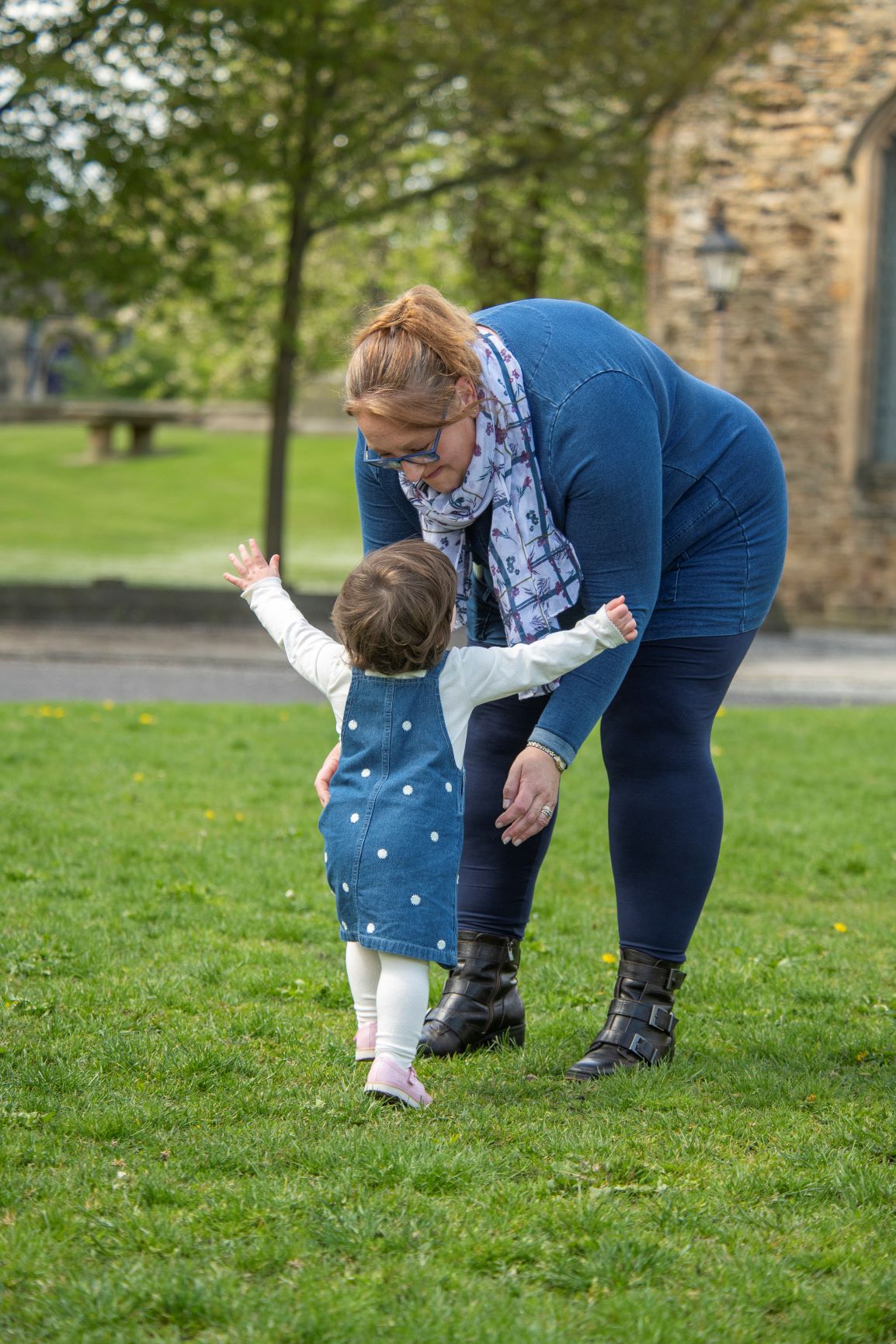 Little girl running towards mam