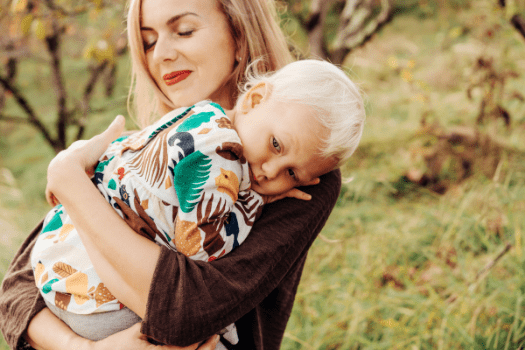Blonde lady holding young boy