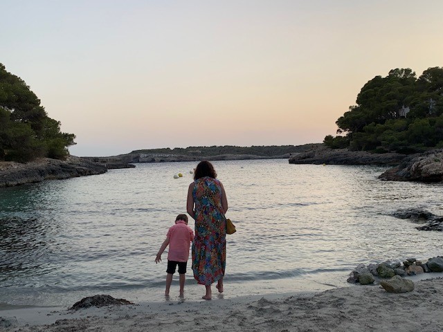 Woman and 6-year-old son at the beach