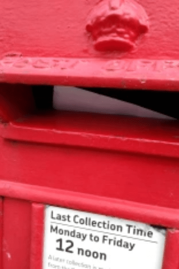 Red postbox with letter