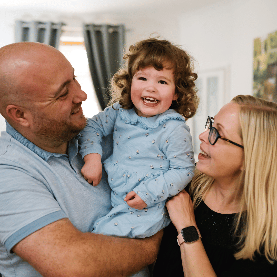 Sean and Kelly with a child