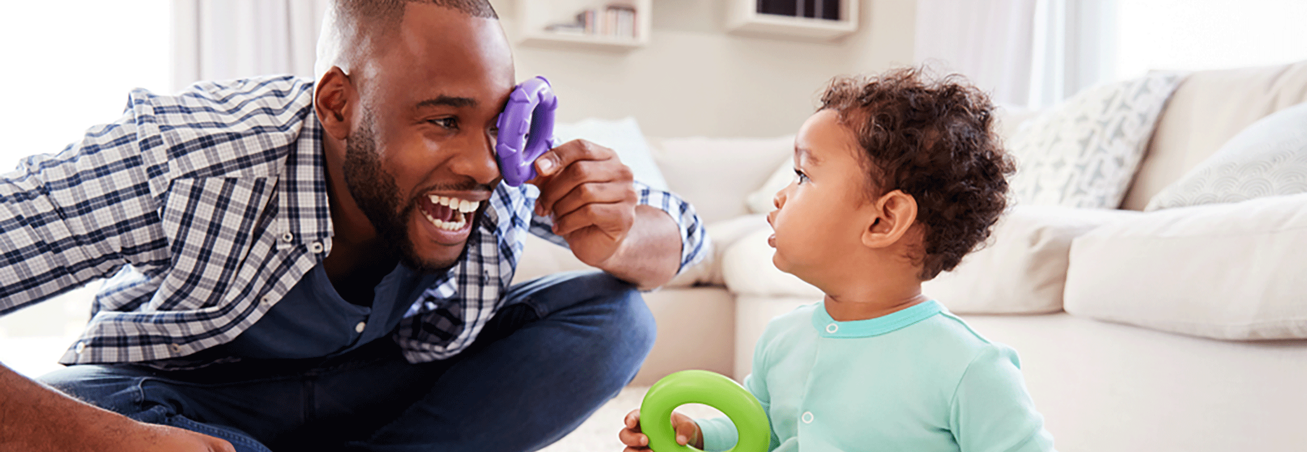 Man and child playing with toys