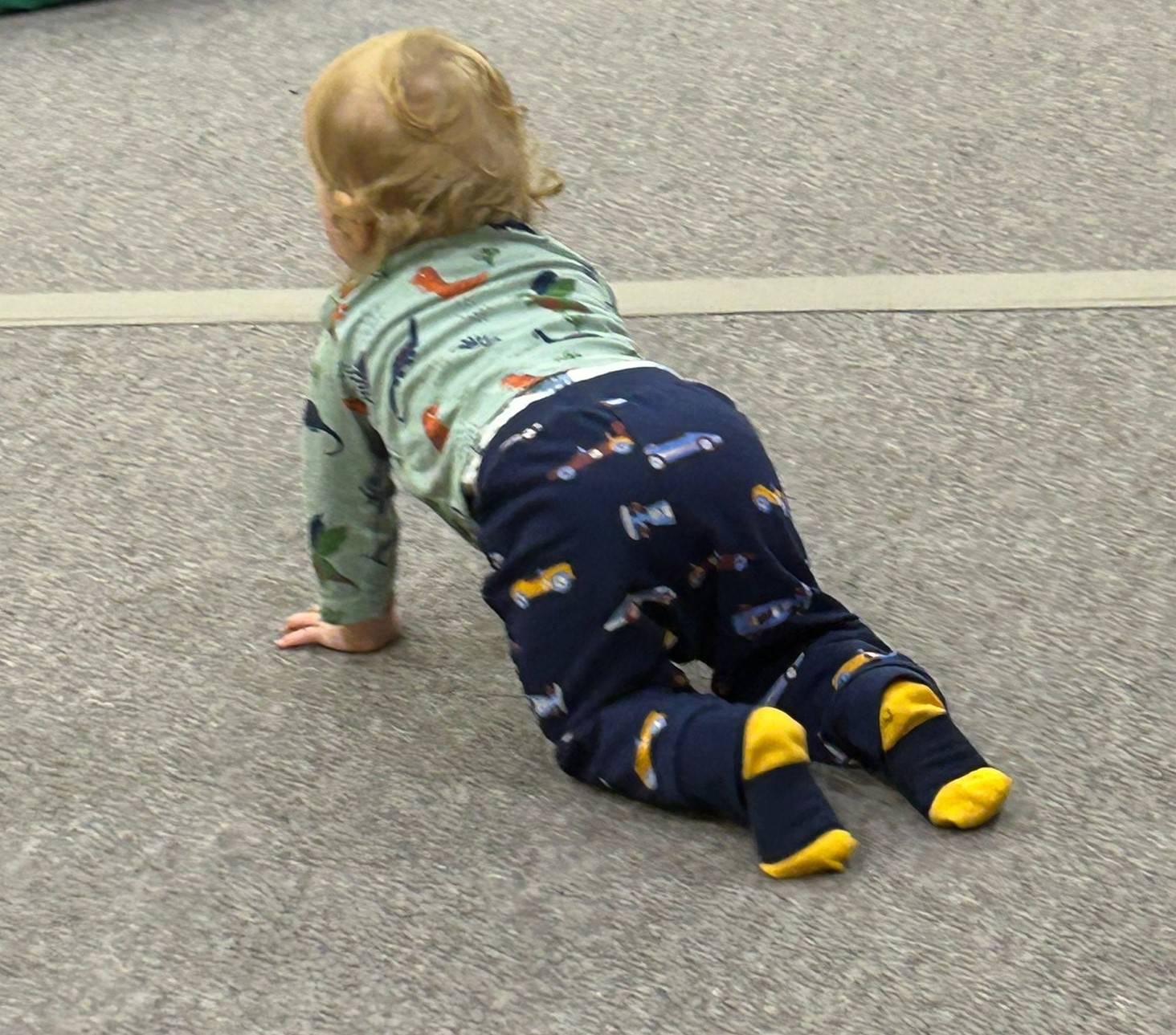 Child crawling on tarmac
